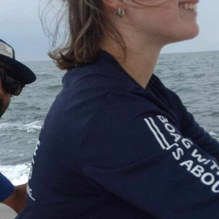 A Maritime Gal riding offshore in the center console with crew