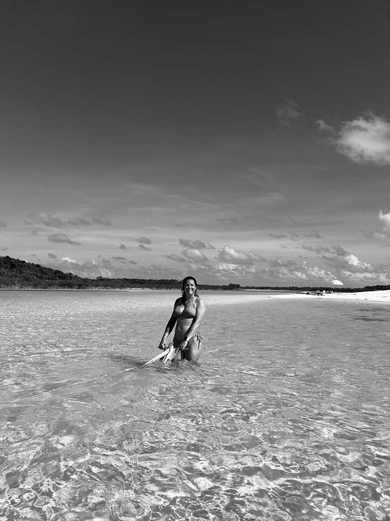 A Maritime Gal pulling anchor line in shallow water, black and white